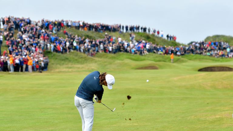 Tommy Fleetwood of England hits his second shot on the 2nd hole during the third round of the 146th Open Championship