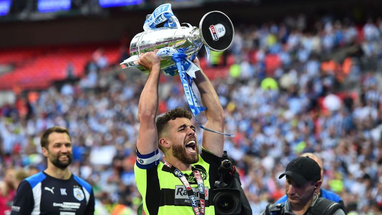 Huddersfield captain Tommy Smith has signed a new three-year contract at the club