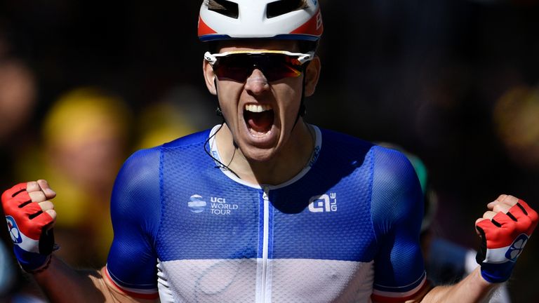 France's Arnaud Demare celebrates as he crosses the finish line 
