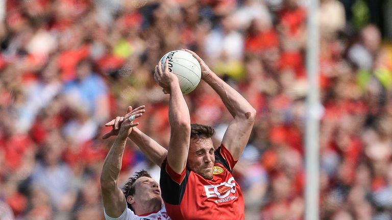 Niall Donnelly of Down in action against Colm Cavanagh of Tyrone  during the Ulster GAA Football Senior Championship Final match