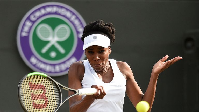 US player Venus Williams returns against Japan's Naomi Osaka during their women's singles third round match on the fifth day of the 2017 Wimbledon Champion