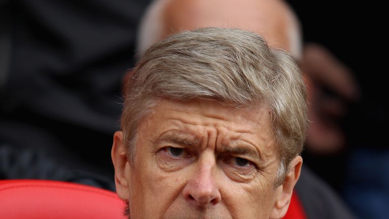 Arsenal manager Arsene Wenger looks on ahead of the Barclays Premier League match between Manchester United and Arsenal a