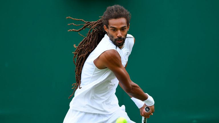 Germany's Dustin Brown returns against Portugal's Joao Sousa during their men's singles first round match on the first day of the 2017 Wimbledon