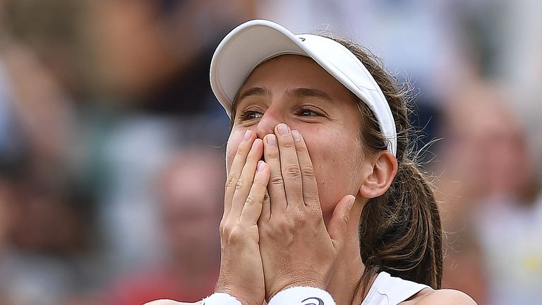 Johanna Konta reacts after winning her fourth round match against France's Caroline Garcia