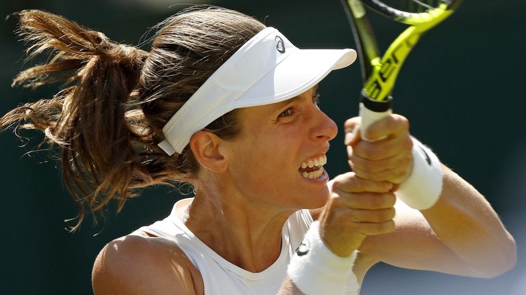 Britain's Johanna Konta returns against Croatia's Donna Vekic during their women's singles second round match on the third day of the 2017 Wimbledon