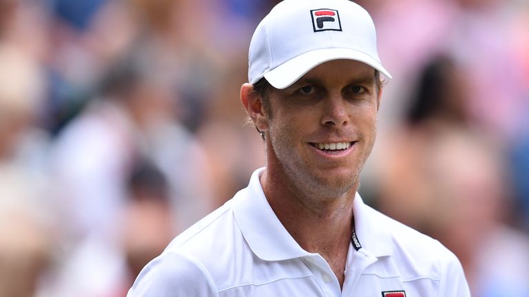 US player Sam Querrey celebrates after winning the first set against Croatia's Marin Cilic during their men's singles semi-final match