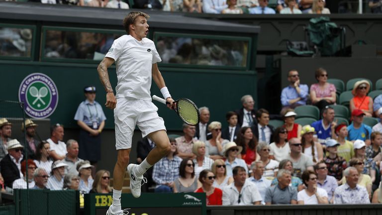 Kazakhstan's Alexander Bublik reacts after playing a shot through his legs to Britain's Andy Murray during their men's singles first round match