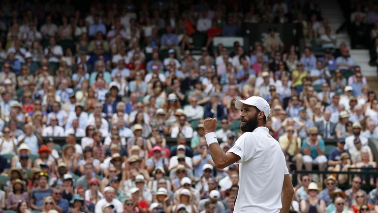 France's Benoit Paire reacts after breaking the serve of Britain's Andy Murray during their men's singles fourth round match