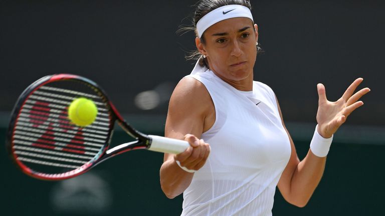 France's Caroline Garcia returns against Britain's Johanna Konta during their women's singles fourth round match on the seventh day of 2017 Wimbledon