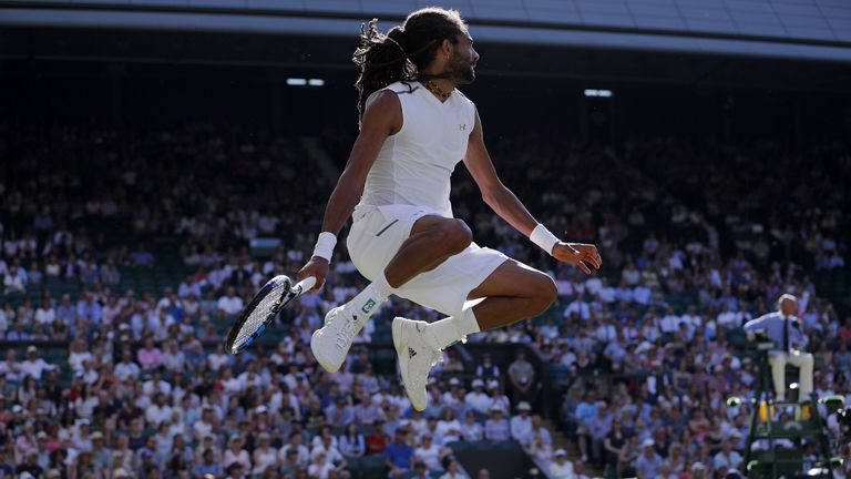 Germany's Dustin Brown reacts after winning a point against Britain's Andy Murray during their men's singles second round match