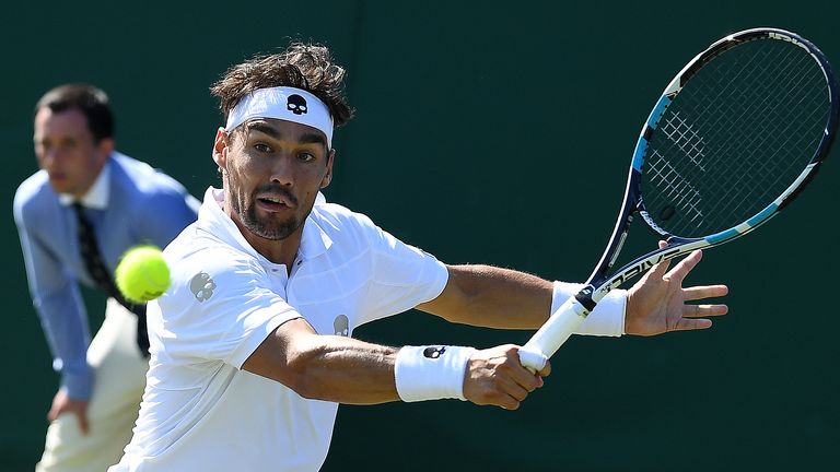 Italy's Fabio Fognini returns against Czech Republic's Jiri Vesely during their men's singles second round match on the third day of Wimbledon