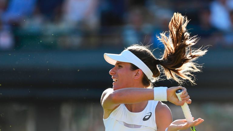 Johanna Konta returns against Hsieh Su-Wei during their first round singles match at Wimbledon