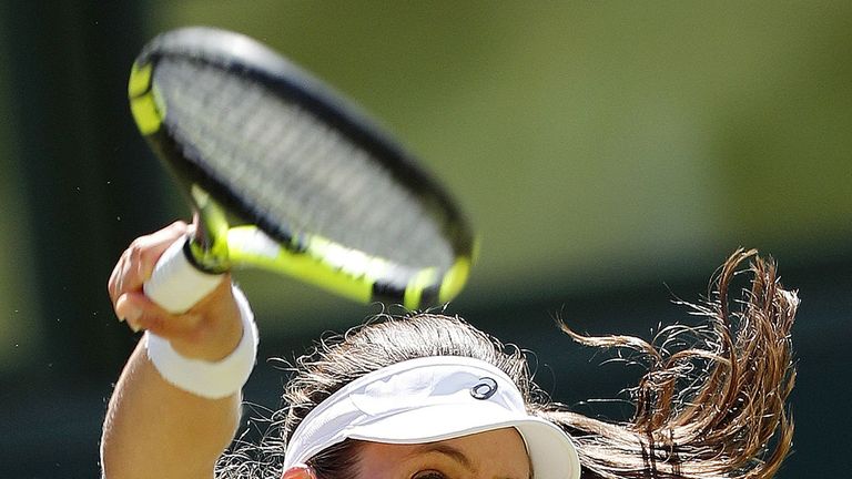 Johanna Konta serves against Donna Vekic during their second round singles match at Wimbledon