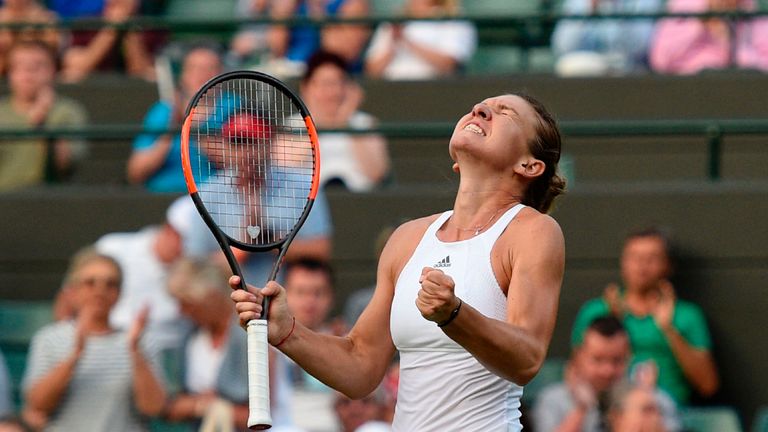 Romania's Simona Halep celebrates beating Brazil's Beatriz Haddad Maia during their women's singles second round match on the third day of Wimbledon