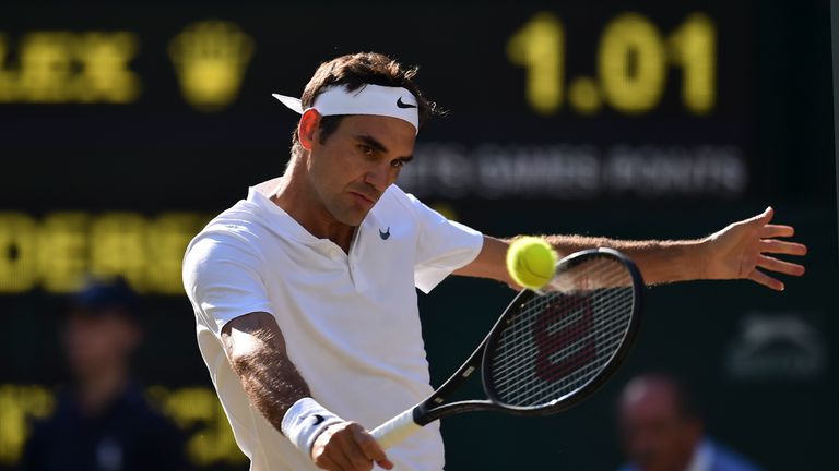 Roger Federer returns against Tomas Berdych during their men's singles semi-final match on the eleventh day of 2017 Wimbledon