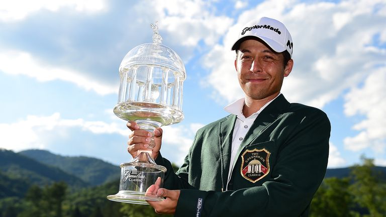 Xander Schauffele poses with the trophy after the final round of The Greenbrier Classic 