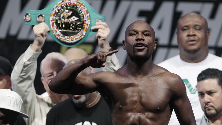 Floyd Mayweather Jr. of the US weighs in for his fight with Marcos Maidana of Argentina (out of frame) during their weigh-in at The MGM Grand in September 