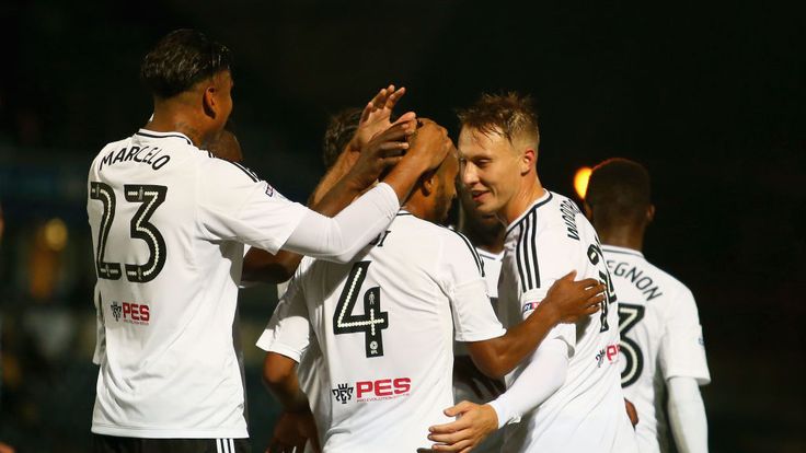 Denis Odoi of Fulham celebrates scoring his teams second goal with teammates during the Carabao Cup First Round match bet