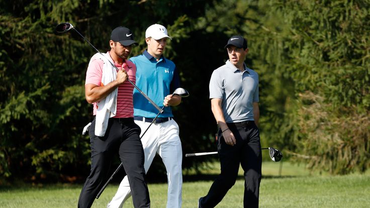 AKRON, OH - AUGUST 03:  Jason Day of Australia, Jordan Spieth and Rory McIlroy of Northern Ireland and walk down the 16th fairway during the first round of