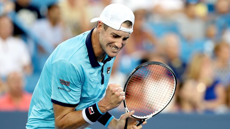 John Isner celebrates a point against Viktor Troiki of Serbia during the Western & Southern Open