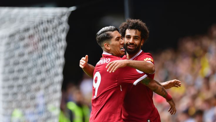 Mohamed Salah celebrates Liverpool's third with Roberto Firmino