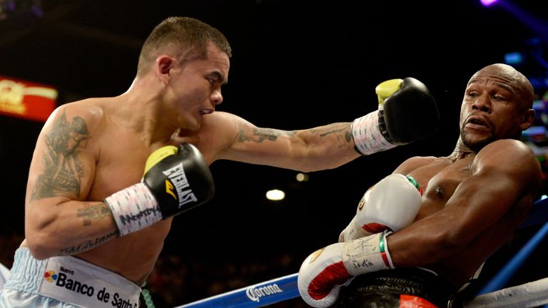 LAS VEGAS, NV - MAY 03:  (L-R) Marcos Maidana throws a left at Floyd Mayweather Jr. during their WBC/WBA welterweight unification fight at the MGM Grand Ga