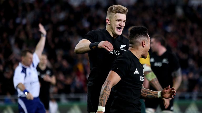 Damian McKenzie celebrates with Aaron Smith after the scrum-half's score