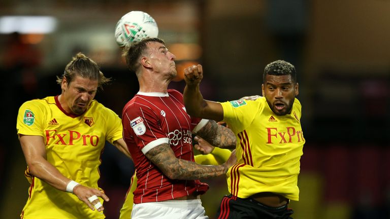 Aden Flint (C) is challenged by Sebastian Prodl and Adrian Mariappa during the Carabao Cup Second Round