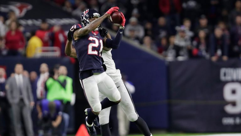 HOUSTON, TX - JANUARY 07:  A.J. Bouye #21 of the Houston Texans intercepts a pass from Connor Cook #8 of the Oakland Raiders during the second half of thei