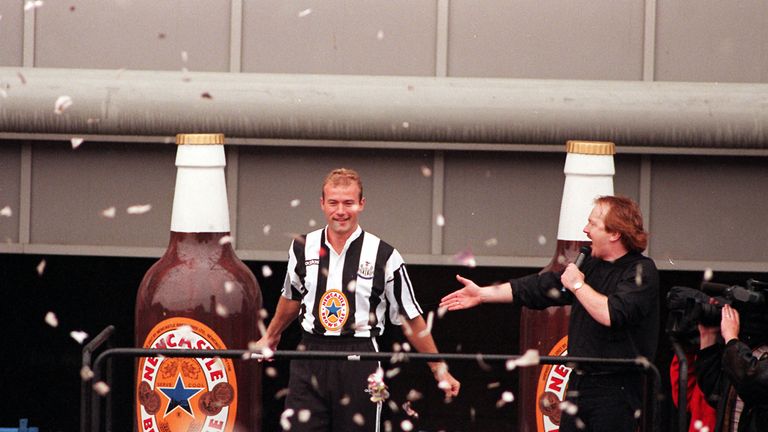 Alan Shearer dressed in the Newcastle strip, greets the fans of Newcastle United after he was officially introduced as their new signing at St James's Park