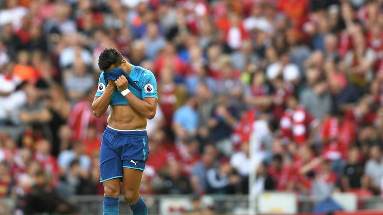 Alexis Sanchez with his head in his hands during the 4-0 defeat to Liverpool at Anfield