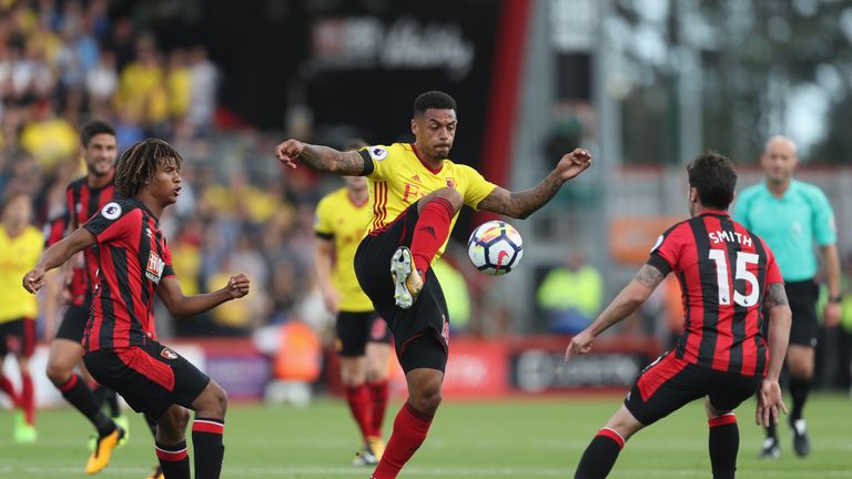 BOURNEMOUTH, ENGLAND - AUGUST 19: Andre Gray of Watford controls the ball while under pressure from Adam Smith of AFC Bournemouth during the Premier League