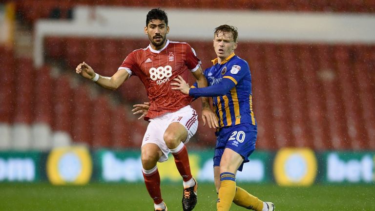 Andreas Bouchalakis of Nottingham Forest and Jon Nolan of Shrewsbury battle for possession during the Carabao Cup 