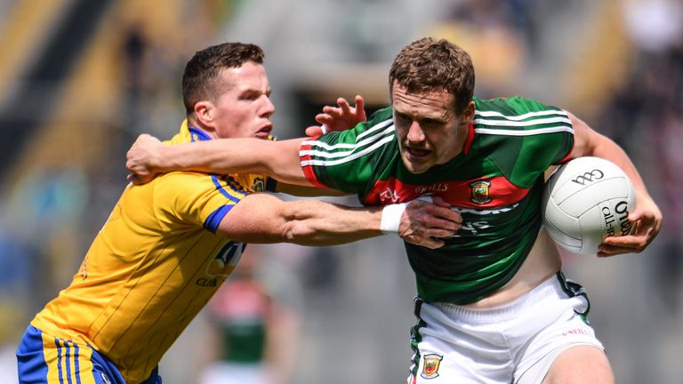  Andy Moran of Mayo is tackled by Sean McDermott of Roscommon 