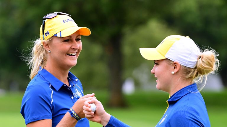 WEST DES MOINES, IA - AUGUST 17:  Anna Nordqvist of Team Europe and Charley Hull celebrate a putt on the 18th green during practice for the Solheim Cup at 