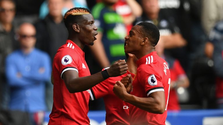 Anthony Martial of Manchester United celebrates scoring his sides fourth goal with Paul Pogba