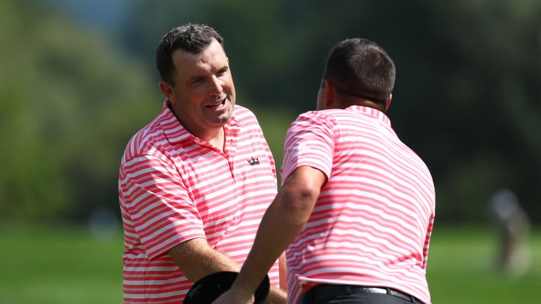 PASSAU, GERMANY - AUGUST 17:  Anthony Wall of England is congratulated on his victory on the 18th green by Sam Walker of England (R) during round one of th