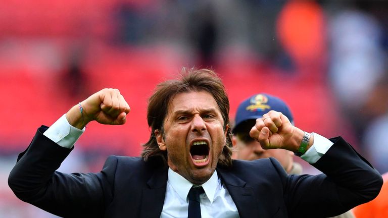 Chelsea head coach Antonio Conte (C) celebrates on the pitch at the end of the Premier League football match between Tottenham at Wembley