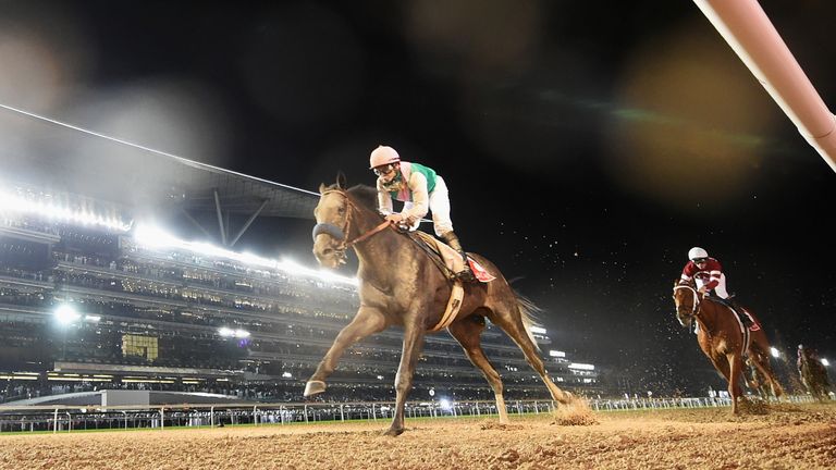 DUBAI, UNITED ARAB EMIRATES - MARCH 25:  Mike Smith riding Arrogate wins the Dubai World Cup Sponsored By Emirates Airline during the Dubai World Cup at th