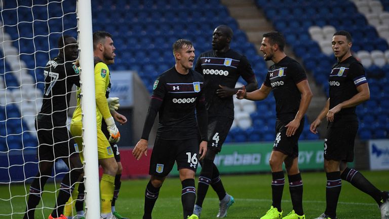 COLCHESTER, ENGLAND - AUGUST 09:  Aston Villa goalkeeper Jed Steer celebrates with Andre Greent team mates after saving a penalty during the Carabao Cup Fi
