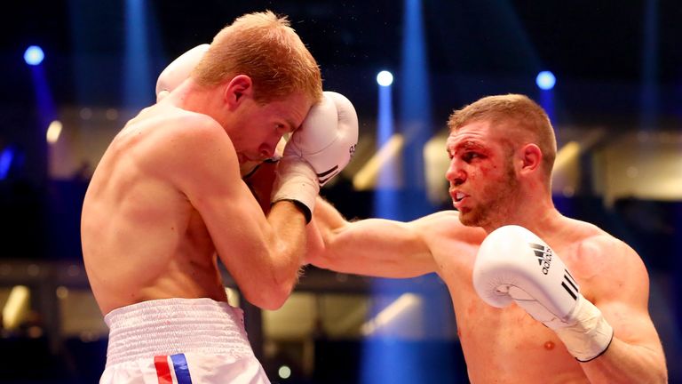 Baptiste Castegnaro (R) of France exchange punches with Stefan Haertel of Germany during the super-middleweight fight on February 21, 2015 in Berlin.
