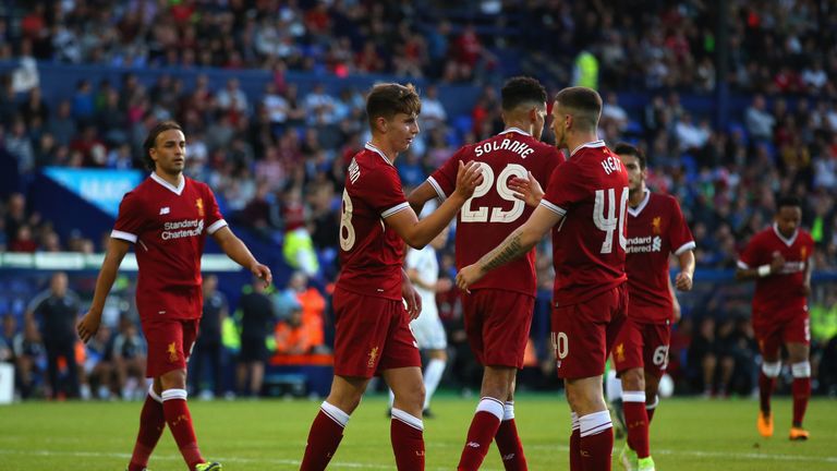BIRKENHEAD, ENGLAND - JULY 12:  Ben Woodburn of Liverpool celebrates with Ryan Kent after scoring from the penalty spot during a pre-season friendly match 