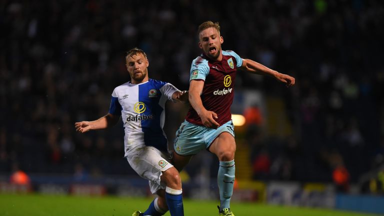 BLACKBURN, ENGLAND - AUGUST 23: Charlie Taylor of Burnley and Harry Chapman of Blackburn in action during the Carabao Cup Second Round match between Blackb