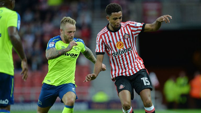 SUNDERLAND, ENGLAND - AUGUST 04: Brendan Galloway of Sunderland takes on Johnny Russell of Derby County during the Sky Bet Championship match between Sunde