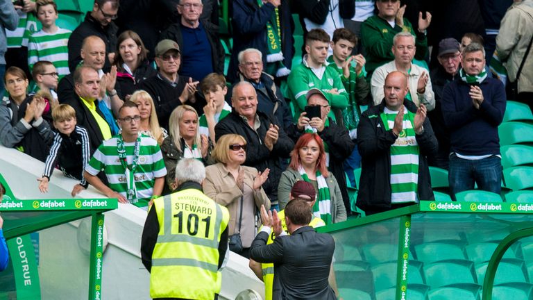 Brendan Rodgers applauds the fans as he leaves the pitch