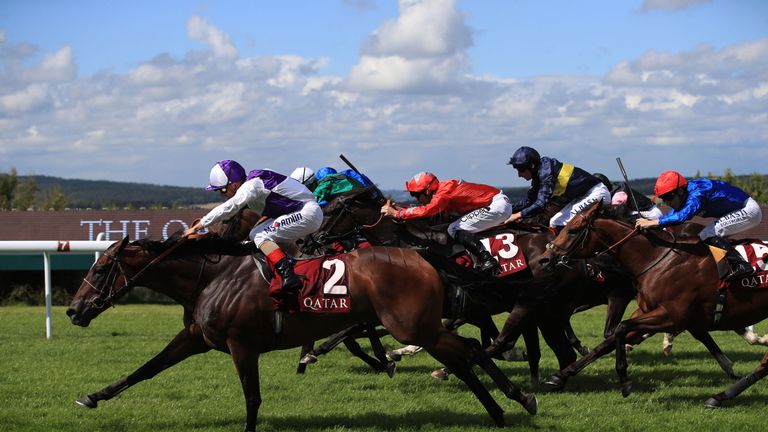 Breton Rock ridden by jockey Andrea Atzeni (left) on the way to winning the Qatar Lennox Stakes