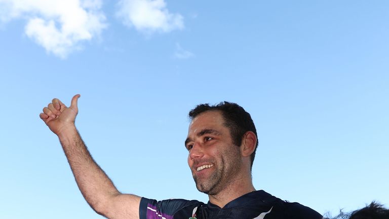 MELBOURNE, AUSTRALIA - JULY 30:  Cameron Smith of the Storm is carried off the ground after he played his 350th match during the round 21 NRL match between