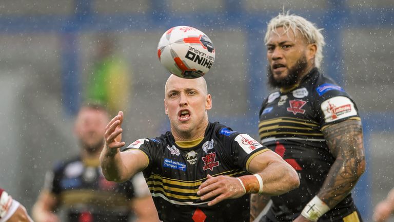  Wigan Warriors v Salford Red Devils - Halliwell Jones Stadium, Warrington, England - Salford's Michael Dobson struggles to control the ball in the rain.