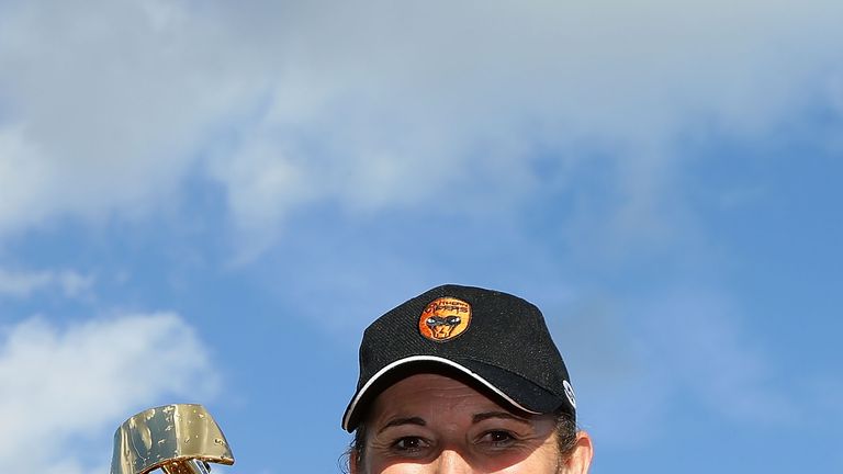 CHELMSFORD, ENGLAND - AUGUST 21: Southern Vipers captain Charlotte Edwards poses for a portrait with the trophy after victory in the final's match against 