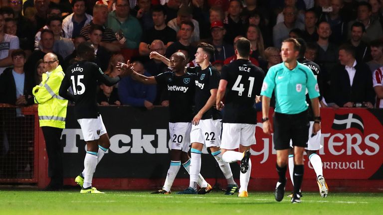 Andre Ayew (second left) celebrates with his West Ham team-mates after he scores their side's second goal of the game during the Carabao Cup, Second Round